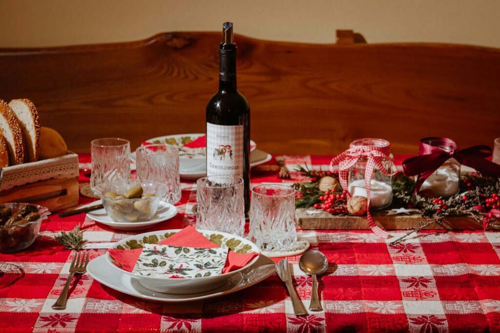 Festive dinner table with a red checkered tablecloth