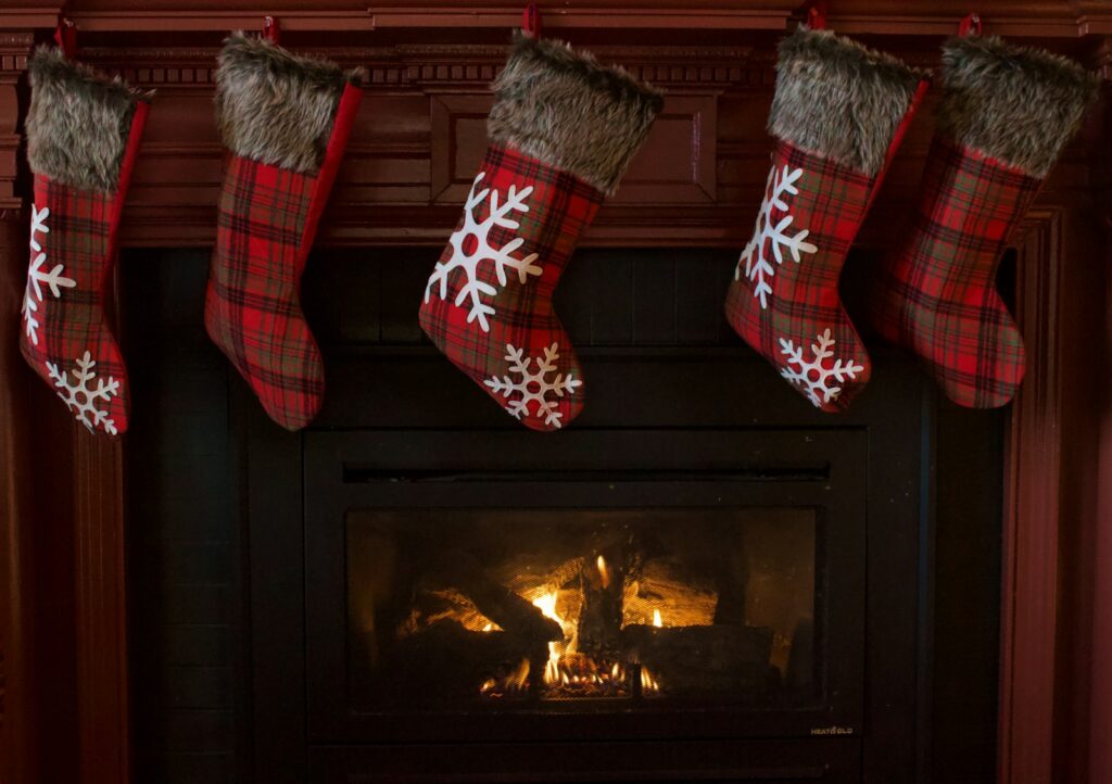 Christmas stockings hanging above a fireplace